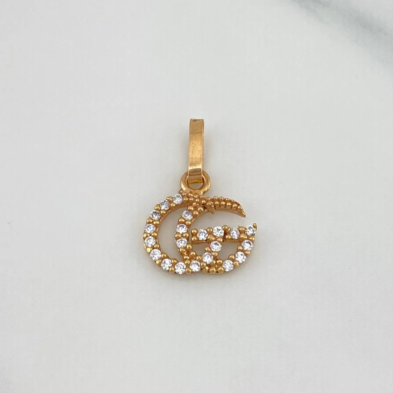 Dije Gg 0.55 g / 1/2 in Oro Rosa 18K