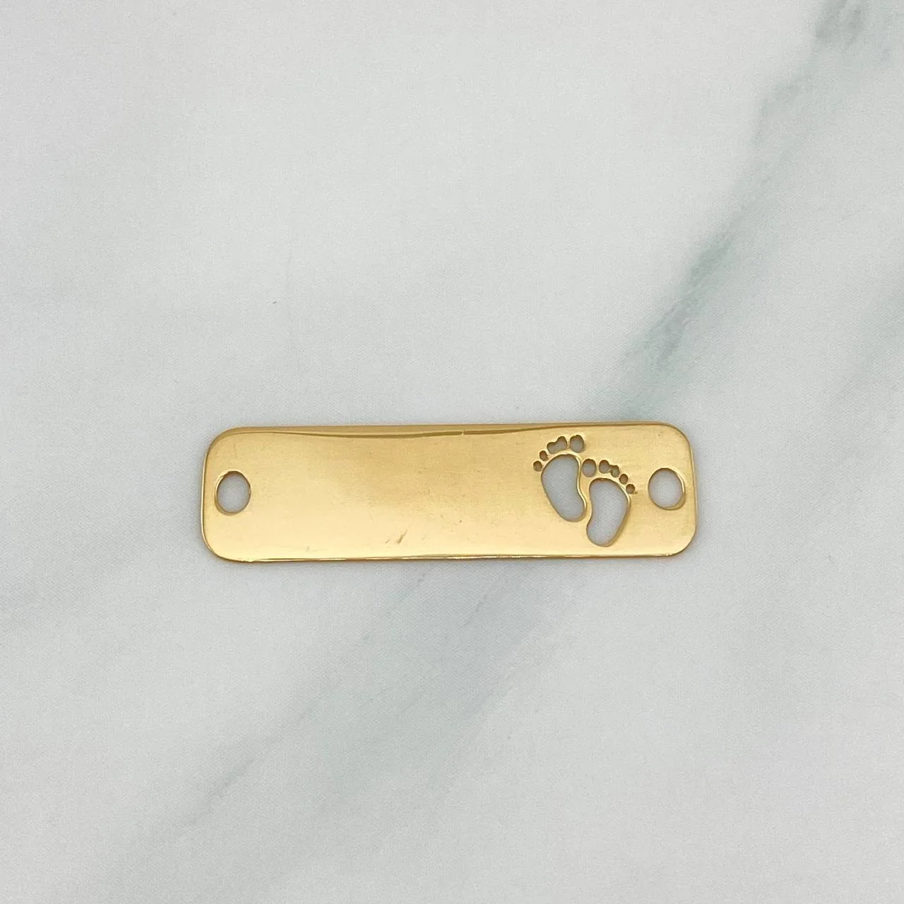Herraje Placa Huellitas 0.85 g / 1 in Oro Amarillo 18K