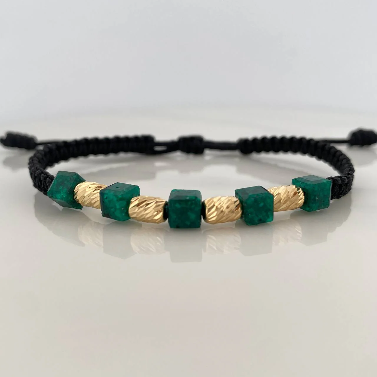 Pulsera Negra Morralla Cubica 5mm Cilindros 4 und Oro Amarillo 18K %