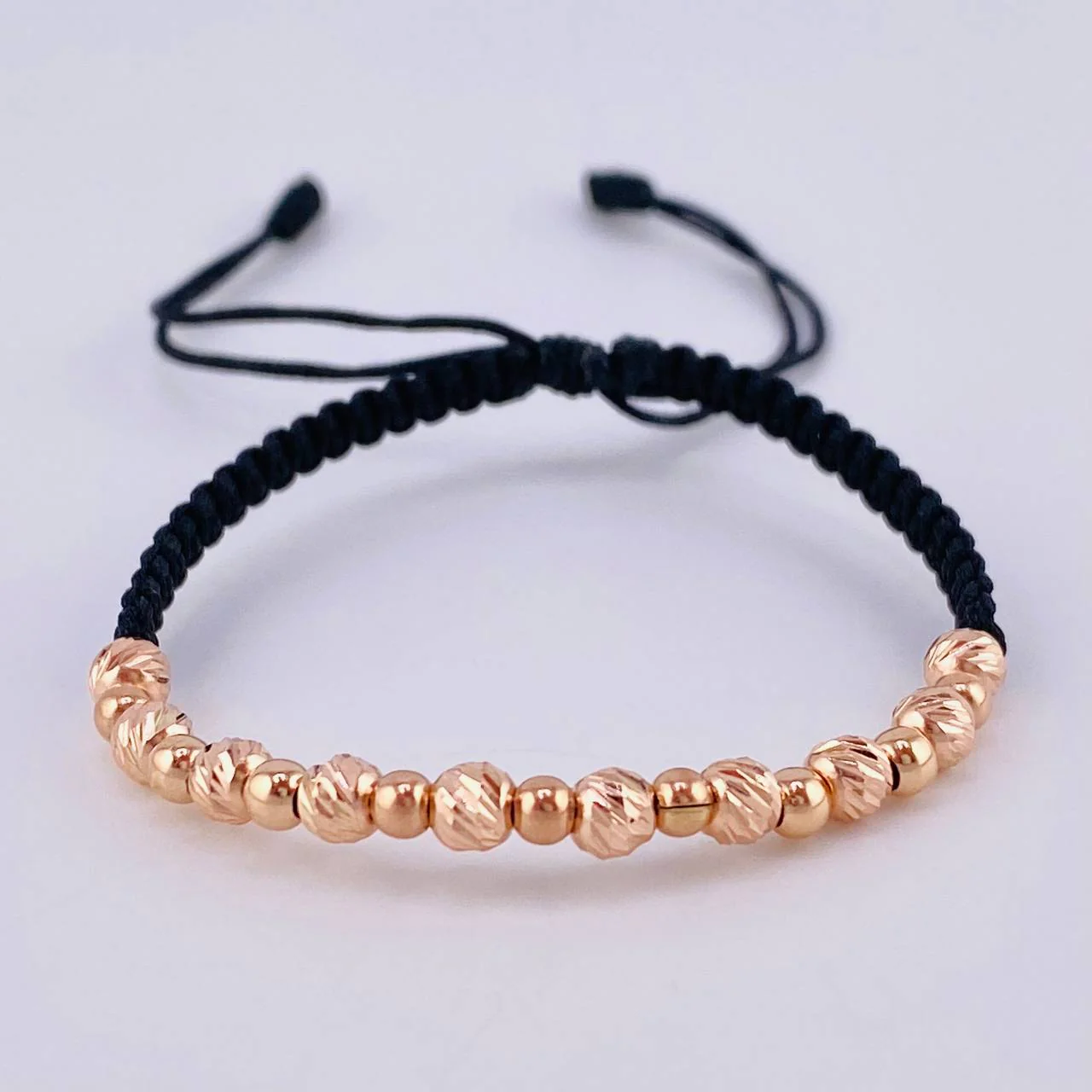 Pulsera Tejida Negra Bolas Diamantadas 10 Und- 4Mm/ Lisas 9 Und- 3Mm Oro Rosa 18K (A.C)